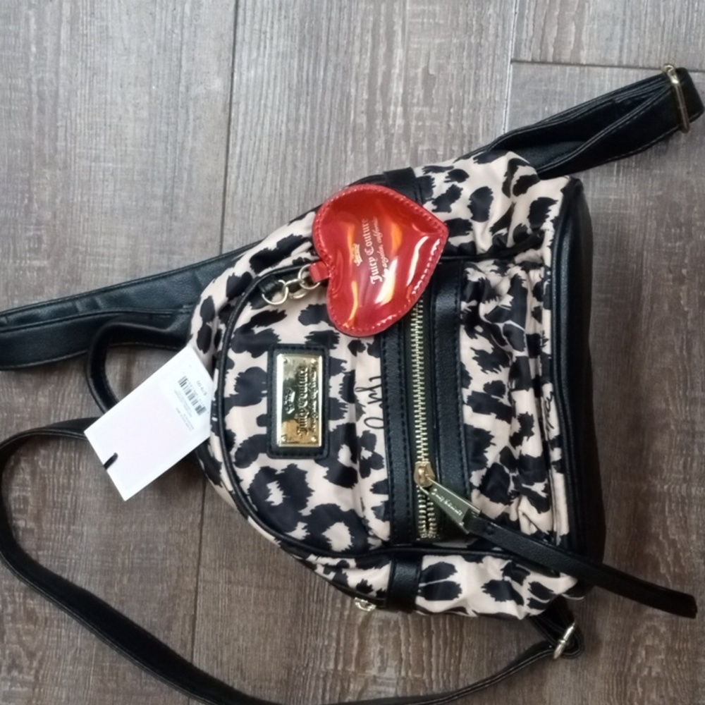 Juicy Couture mini backpack purse. New w/tags